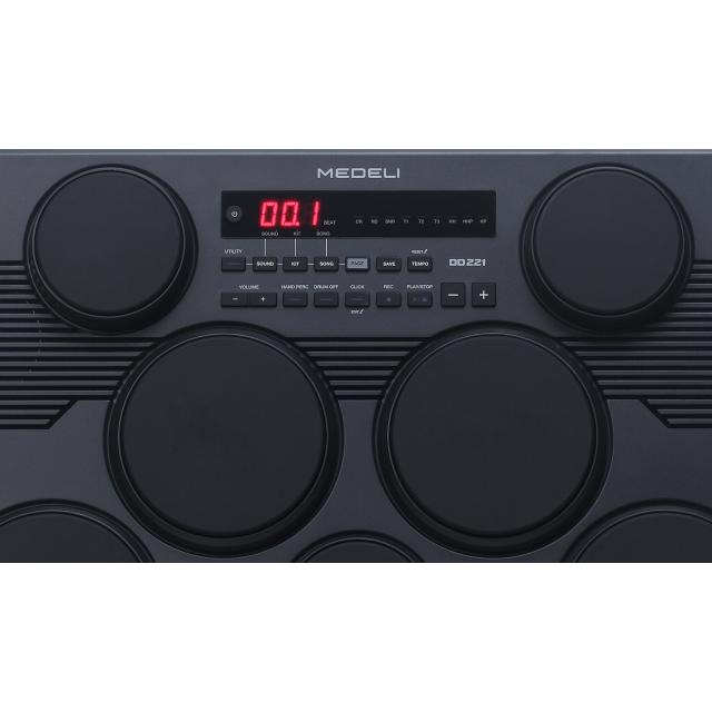 Portable drum kit with 7 touch-sensitive pads and 2 pedals