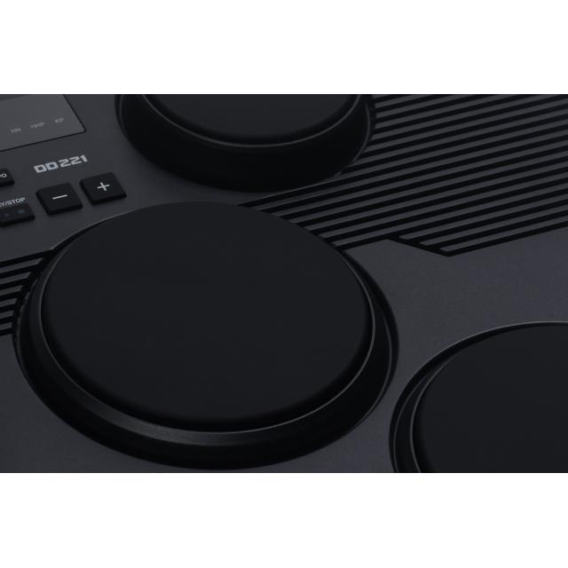 Portable drum kit with 7 touch-sensitive pads and 2 pedals