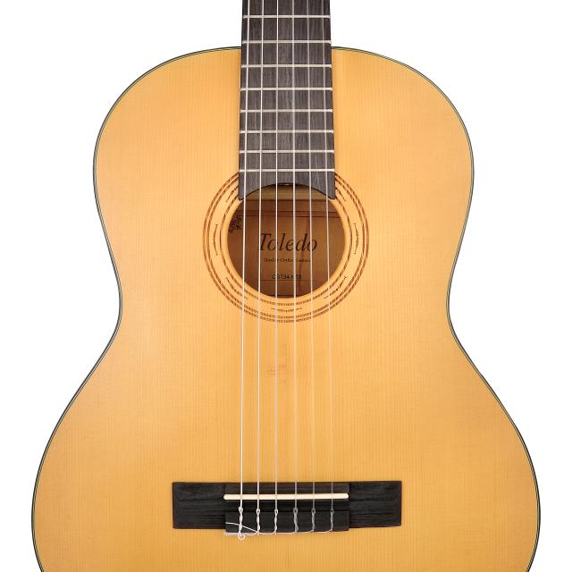 3/4 classical guitar featuring solid spruce top and engraved rosette