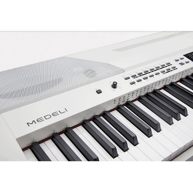 Stage Piano with 88 Keys hammer action keyboard, automatic accompaniments and white finish.