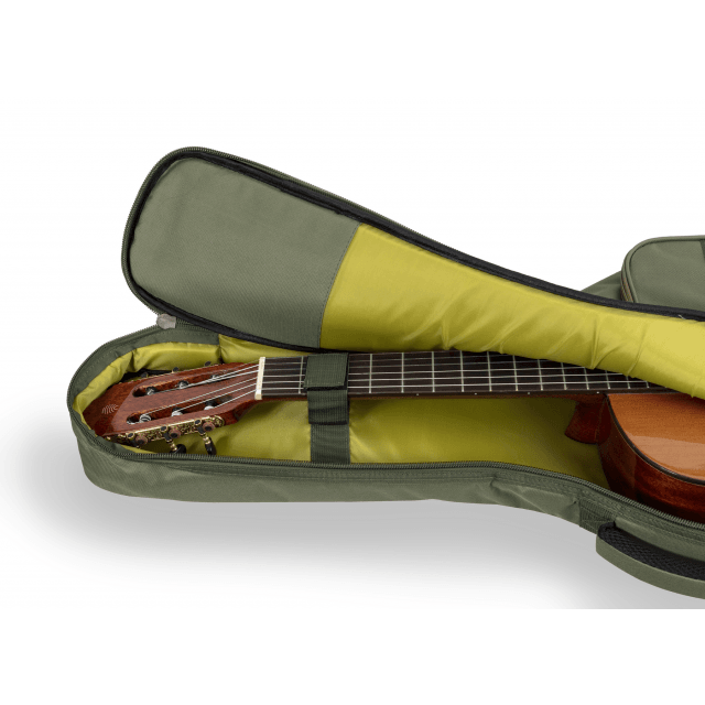 Acoustic guitar bag with suede leather inserts